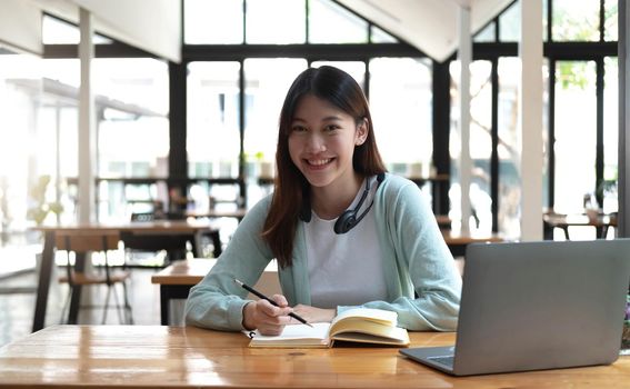 Asian women chatting in video conferencing or virtual meeting at home. Look at the camera.