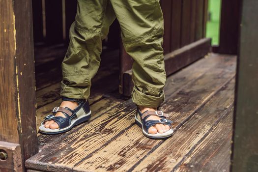 children's orthopedic shoes on the boy's feet.