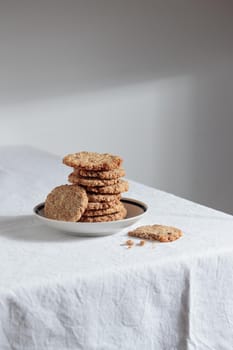 Stack of homemade oat cookies on a table