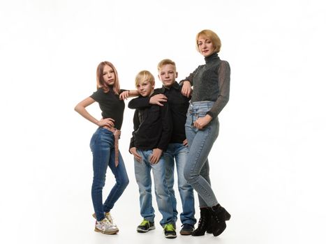 Mom and three children, two boys and a girl, in full growth, isolated on a white background