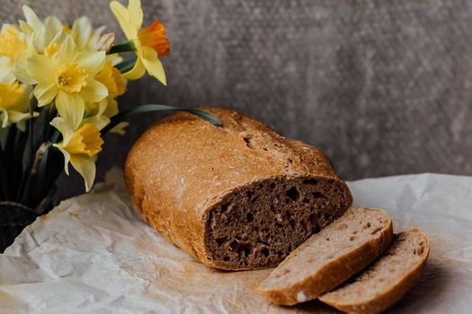 Sliced rye bread on cutting board. Whole grain rye bread with seeds.