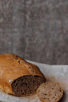 Fresh homemade sourdough bread on a rustic background with copy space