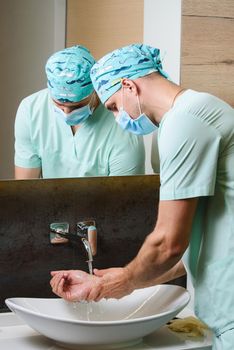 Hygiene for everyone to stop pandemic of coronavirus covid 19. Medical staff do hygiene for hands. Disinfection for hands under water with antiseptic