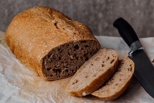 Fresh homemade sourdough bread on a rustic background with copy space