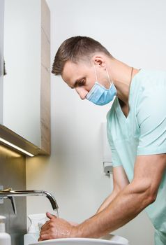 Nurse is washing his hands. Disinfecting method with water and soap to stop coronavirus covid 19.