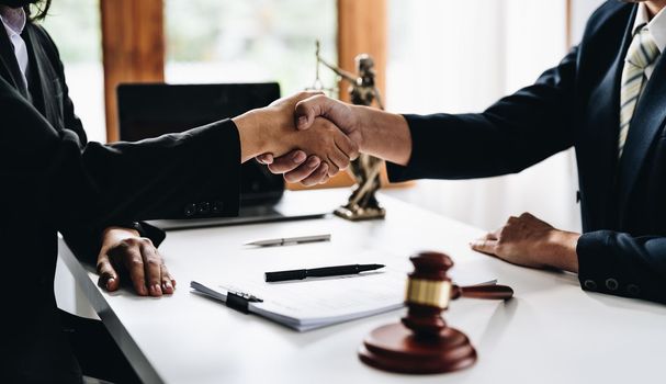 Businessman shaking hands to seal a deal Judges male lawyers Consultation legal services Consulting in regard