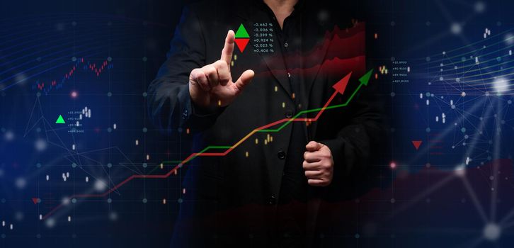 Graph of price growth and indicators. Analysis of indicators on a virtual screen by a businessman in a suit. 