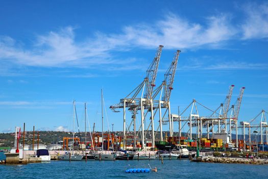 Koper, Slovenia, September 26, 2019: Container ship loading by containers. Import, export and business logistic