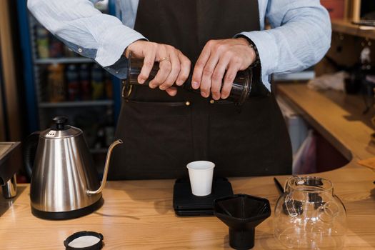 Aeropress coffee alternative making by barista in the cafe. Barista connect details from aeropress together. prepare aeropress to pour it