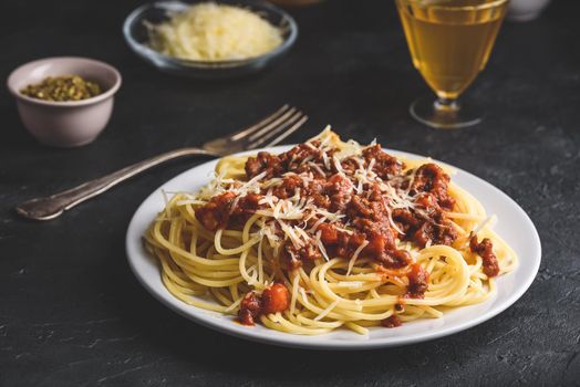 Spaghetti with bolognese sauce and grated parmesan cheese