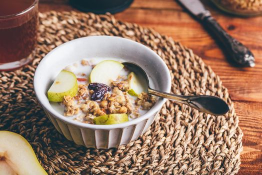 Bowl of Granola with Pear and Raisins for Breakfast