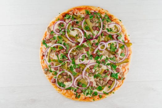 Big pizza isolated on white background. Tasty fast food at quarantine coronavirus covid-19 period. Food delivery for people who stay at home