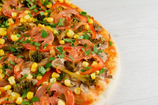 Pizza close-up on white wooden background. Food delivery for people who stay at home. Tasty fast food at quarantine coronavirus covid-19 period.