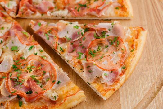 Pizza top view cutted on 8 pieces and one pushed forward. Advert for pizzeria caffee and restaurant. Food delivery at quarantine covid-19 concept.