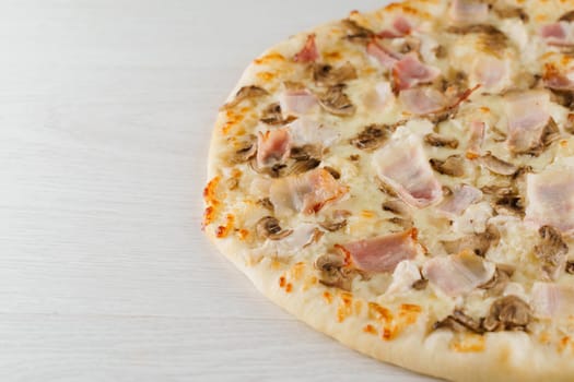 Big pizza isolated on white background. Tasty fast food at quarantine coronavirus covid-19 period. Food delivery for people who stay at home