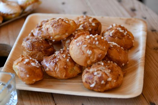 Chouquettes French light cakes sprinkled with a sugar