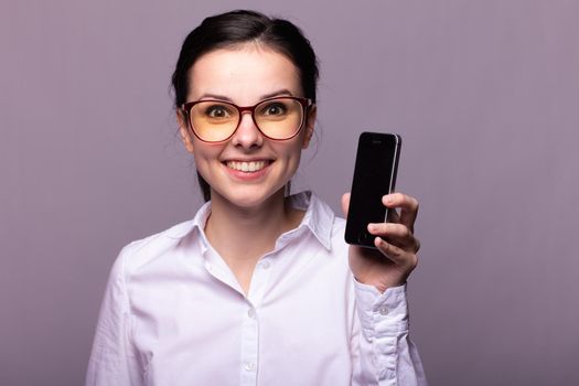 woman in a white shirt and glasses communicates on the phone. High quality photo