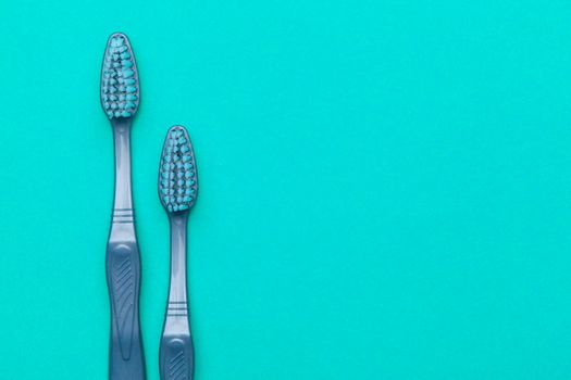 Flat lay composition with manual toothbrushes on color background, close up. creative photo.