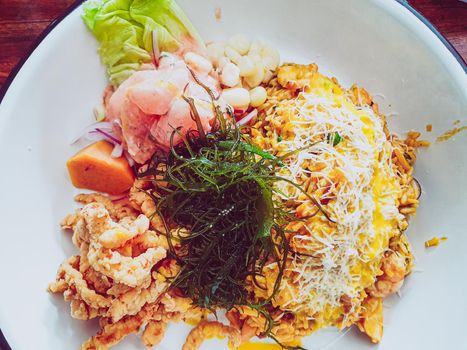 Ceviche with seafood rice and fish chicharron. Peruvian food, seafood trio