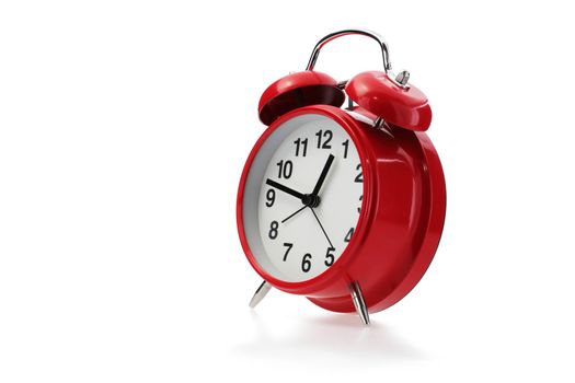 A red retro alarm clock in white with shadow