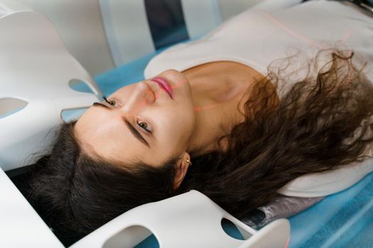 CT diagnosis of a girl with cancer. patient undergoes examination in the clinic using multispiral computed tomography