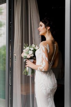 Bride in wedding dress and bridal veil in cafe. Advert for social networks for wedding agency and bridal salon