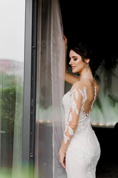 Bride in wedding dress and bridal veil in cafe. Advert for social networks for wedding agency and bridal salon