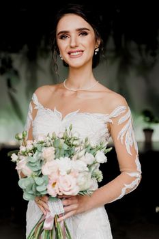 Close-up bride in wedding dress and bridal veil in cafe. Advert for social networks for wedding agency and bridal salon