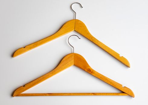Wooden hangers on white background