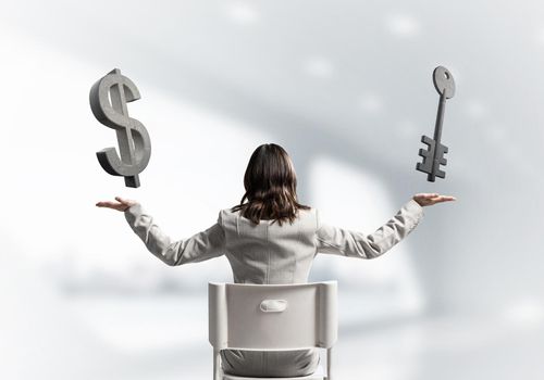 Woman showing balance gesture with dollar and key 3d models on palms. Back view long haired woman in white suit sitting on white chair. Business concept with copy space. Advertising and promotion