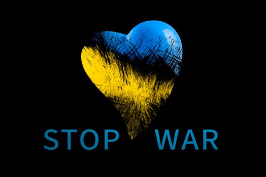 Stop war in Ukraine. Save Ukraine. The heart is painted in the colors of the Ukrainian flag - blue and yellow. Stop war text, poster on black background.