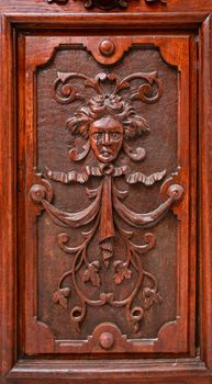 Old carved wooden door in Villajoyosa town, Alicante, Spain