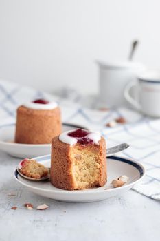 Runebergin Torttuu in a plate on a white table vertical