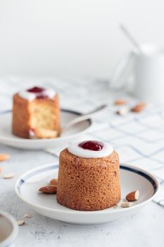 Runebergin Torttuu in a plate on a white table vertical