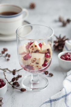 Leipajuusto - traditional Finnish baked cheese - with berries in a glass