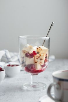 Leipajuusto - traditional Finnish baked cheese - with berries in a glass
