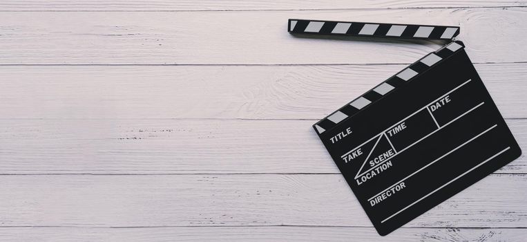 Close up of a vintage wood clapboard on wood background.