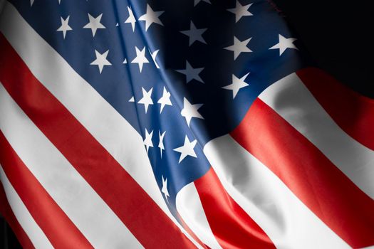 Beautifully waving star and striped American flag. creative photo.