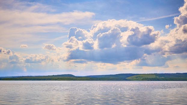 a large natural stream of water flowing in a channel to the sea, a lake, or another such stream.