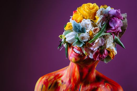 A girl with fresh flowers on her head. Flower Man