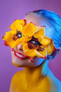 Girl model with yellow flowers around her eyes. Flower Girl