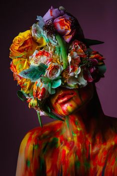 A girl with fresh flowers on her head. Flower Man