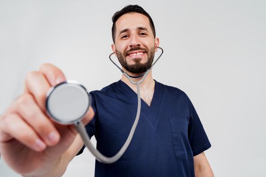 Medical arabian student does auscultation to patient. Doctor uses phonendoscope for auscultation. Medical therapy and treatment