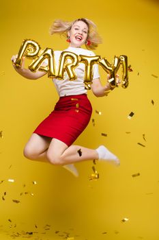 Fashionable womancelebrating a party event having fun and smiling with balloons