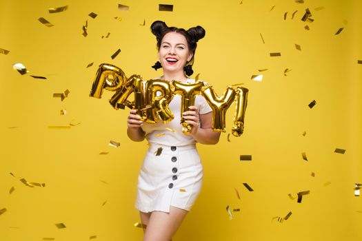 Fashionable womancelebrating a party event having fun and smiling with balloons