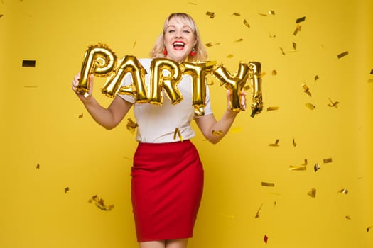 Fashionable womancelebrating a party event having fun and smiling with balloons