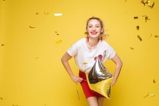 Fashionable womancelebrating a party event having fun and smiling with balloons