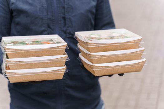 Green natural salads in eco organic boxes. Biodegradable disposable tableware