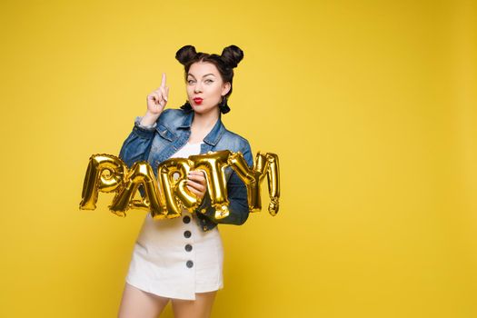 Fashionable womancelebrating a party event having fun and smiling with balloons