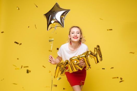 Fashionable womancelebrating a party event having fun and smiling with balloons